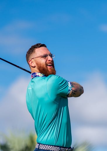 golfer watching his ball after hitting