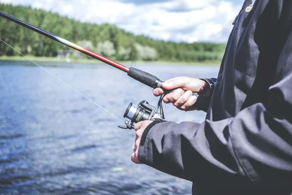 Person Fishing wearing a long sleeve jacket
