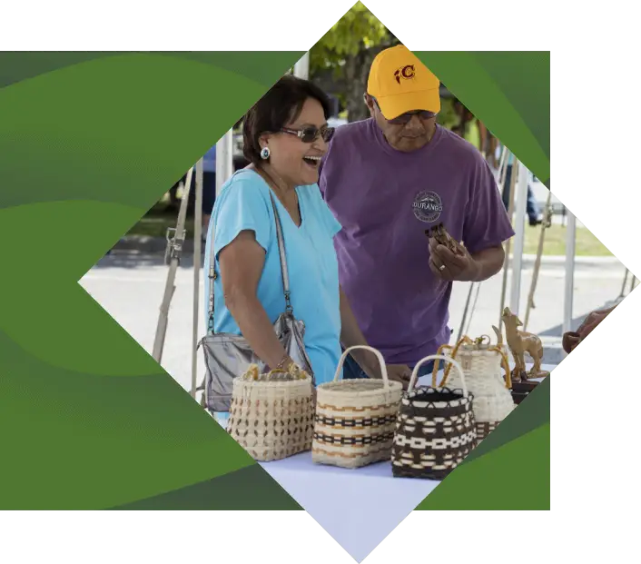 a couple shopping at the island park art market