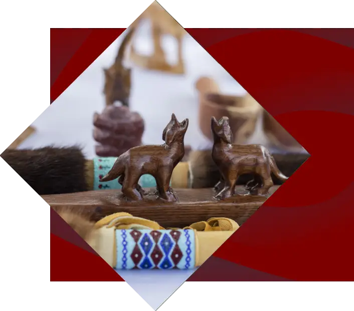 hand carved wooden artwork of small wolves